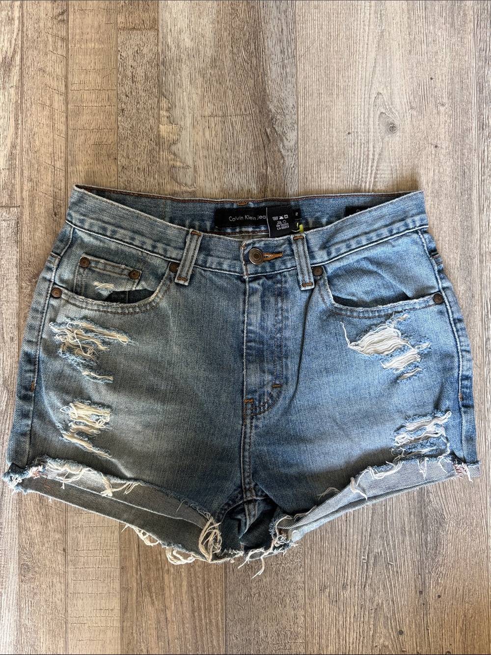 Calvin Klein Light Blue Distressed Denim Shorts